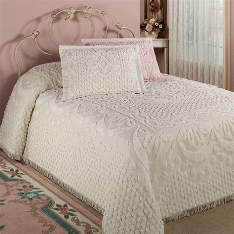 Twin chenille bedspread - Product Description. With its medallion and scroll design, plus bottom bell corners and fringe on three sides, the Medallion chenille bedspread provides a sophisticated style with a touch of old-fashioned charm. The back is color-matched. Made from soft 100% cotton. Machine wash separately.
